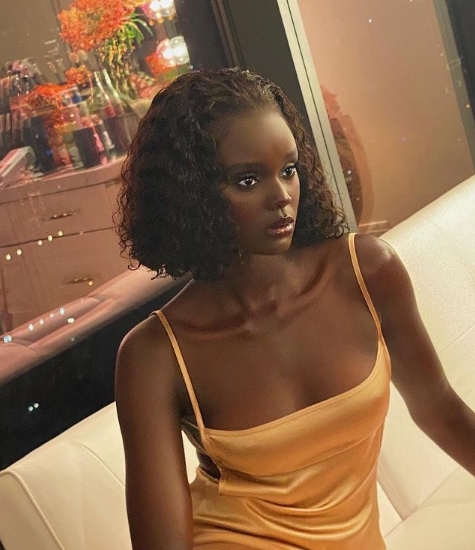 Duckie Thot's Blunt cut bob curly